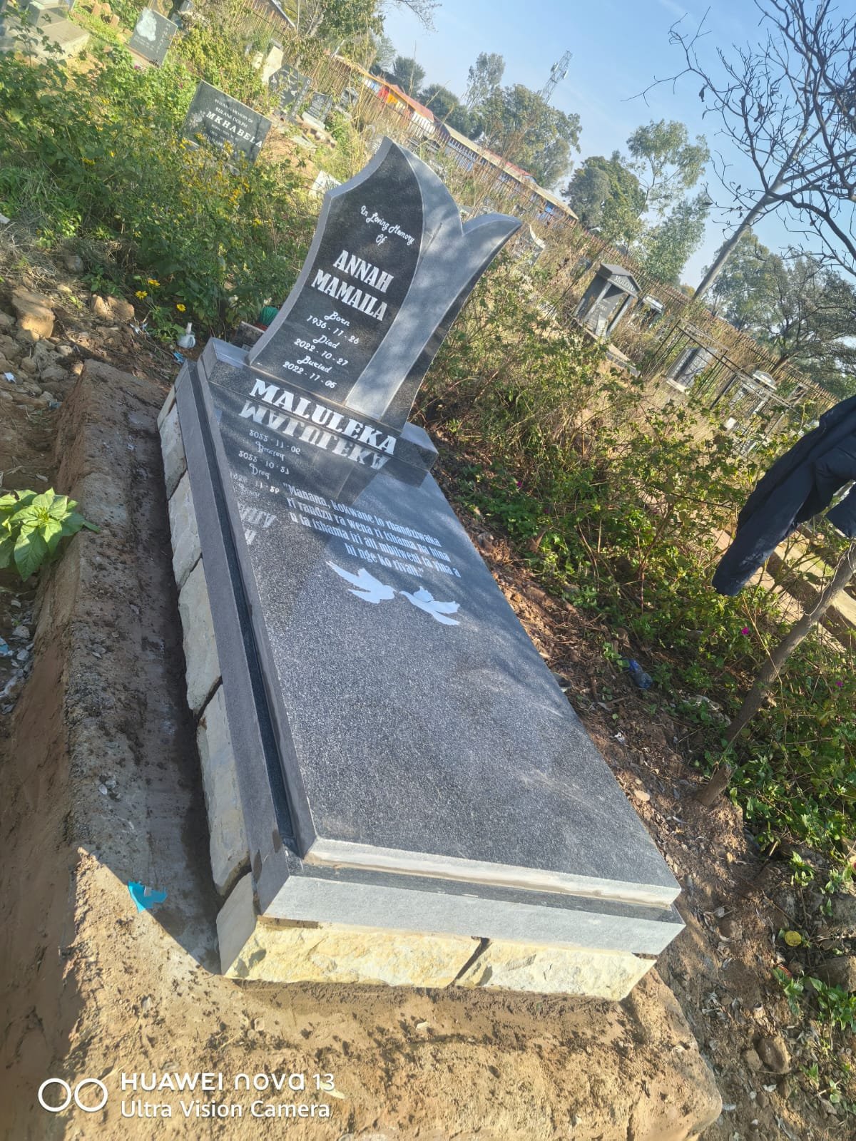 Polished granite single tombstone
