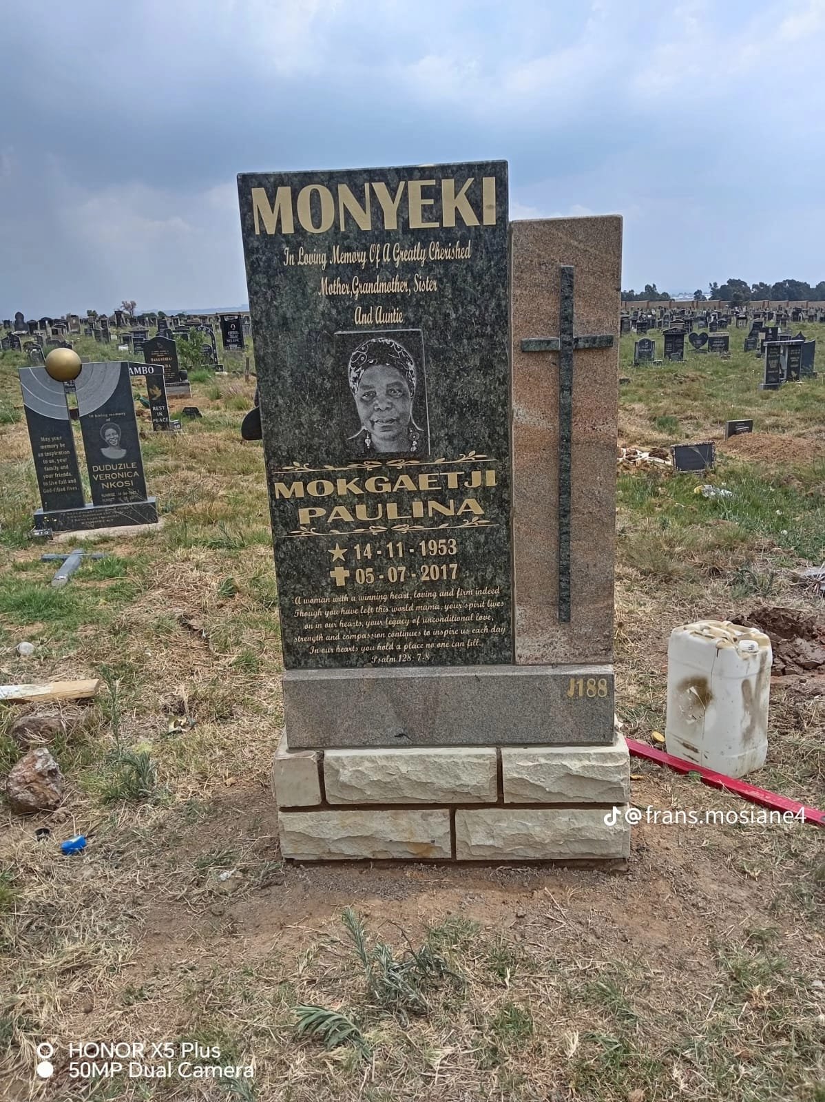 Single tombstone with photo portrait and cross accent