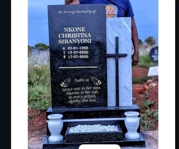 Premium tombstone with cross detail and marble vases