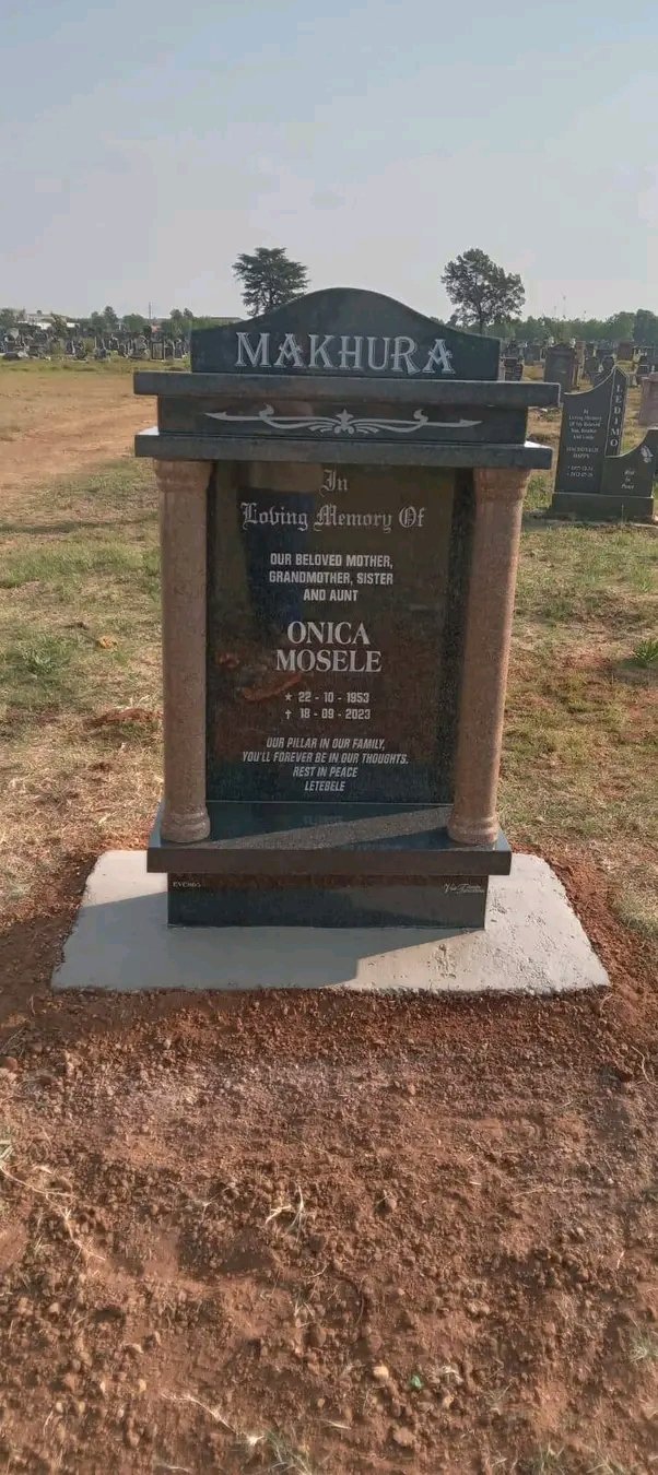 Single memorial with columns and arch headstone