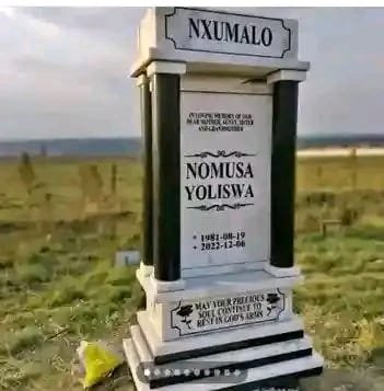 White single tombstone with black column accents