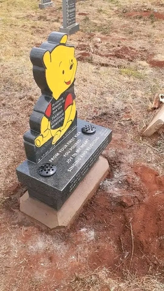 Children's memorial with Winnie the Pooh and vase accents
